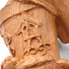 Close up of Baba Yaga statue mortar with chicken leg house design in wood finish