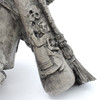 Close up of Baba Yaga statue pestle with detailed design in stone finish