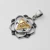 Chakra pendant for the Solar Plexus shown on a silver chain with detailed silver craftsmanship and gold accents