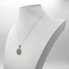 Anahata necklace displayed on a white jewelry bust showing the elegant drape of the sterling silver chain