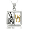 Horoscope pendant: Close-up of a silver and gold Capricorn necklace highlighting the textured goat horns