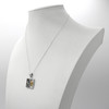 Zodiac necklace: Sterling silver Capricorn pendant displayed on a white mannequin torso showing chain length