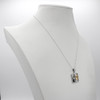Taurus jewelry mystical horoscope necklace displayed on a white jewelry bust, highlighting the silver and gold contrast
