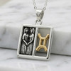 Gemini necklace in fine .925 sterling silver and gold, featuring the detailed twins and astrological symbol inside a polished, minimalist square frame
