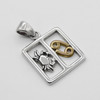 Cancer pendant zodiac necklace highlighting the intricate silver detailing of the crab figure alongside the brilliant gold astrological sign, lying flat against a pristine background