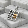Scorpio jewelry mystical horoscope necklace resting gracefully on white marble steps, showcasing the high-quality .925 sterling silver and gold craftsmanship