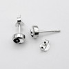 Minimalist Yin Yang earrings for women, small .925 sterling silver studs capturing the balance of black and white resting delicately on white silk
