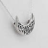 Horned Moon Necklace captured from an angled close-up, highlighting the highly polished .925 sterling silver details of this Celtic Moon Pendant at our pagan jewelry store