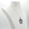 Large tree of life showcased gracefully on a white jewelry bust at our pagan jewelry store, a substantial Celtic tree pendant and sterling silver tree pendant perfect for daily wear