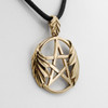 Witch jewelry featuring a close-up angled to the left, showing the intricate veins of the oak leaves wrapping around the bronze pentacle pendant
