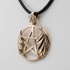 Druid pentacle necklace close-up angled to the right, emphasizing the polished gold-bronze star and the matching oak leaf design on the bail