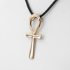 Gold Ankh pendant close-up angled to the left, showing the flawless, polished surface and minimalist design of the Egyptian cross