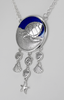 This large Sea Witch necklace features a turtle familiar animal against a vibrant blue enamel background, accented by dangling shells and five pointed star