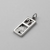 Aries-themed jewelry featuring a dual-metal pendant with the intricate ram sign and zodiac symbol in silver and gold