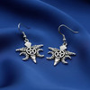 Silver raven hook earrings with a central pentacle star and crescent moons