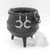 Celtic Witchy Earrings Hanging on Black Cauldron