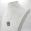 Dragon pendant designed for men, a substantial dragon moon necklace showcased gracefully on a white jewelry bust in solid sterling silver