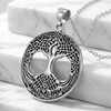 Celtic tree pendant in sterling silver at our pagan jewelry store, featuring an intricate tree of life formed from Celtic knotwork resting gracefully on white marble steps