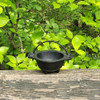 baby witch cauldron, a wiccan ritual tool, is outside during midsummer, in natural light. Perfect wiccan item for gifts, spiritual tools & witchcraft supplies.