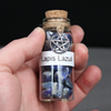 Lapis Lazuli Gemstone Crystal Chips amulet spell supplies, pagan, wiccan, and witchcraft metaphysical store supplies with pentacle charm held in practitioners hand ready for spell work