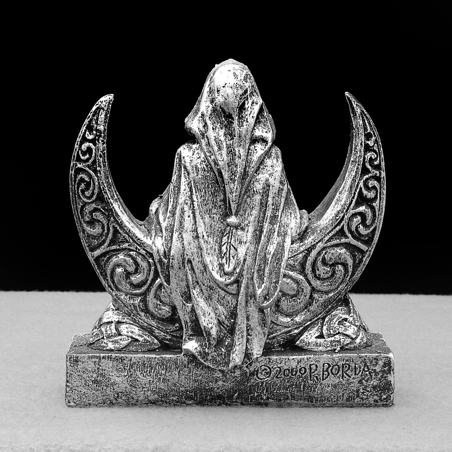 Back view of the pagan goddess figurine, highlighting the intricate Celtic knotwork on the crescent moon and the draped cloak of the silver Wicca statue