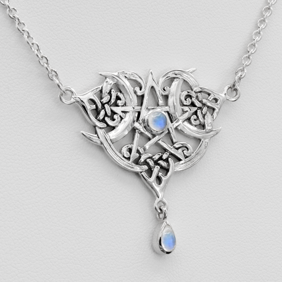 Experience the magic of this Heart Pentacle Necklace, a captivating blend of Wiccan, Pagan, Occult, Mystical, Spiritual, and Witchy Jewelry. Adorned with a mesmerizing Rainbow Moonstone, it joins the ranks of Witch Necklaces, Wiccan, Pagan, and Occult Necklaces, offering a unique and enchanting representation of the Five-Pointed Star, whether you call it a Pentacle or a Pentagram. This is not just a necklace; it's a wearable talisman of your spiritual journey.