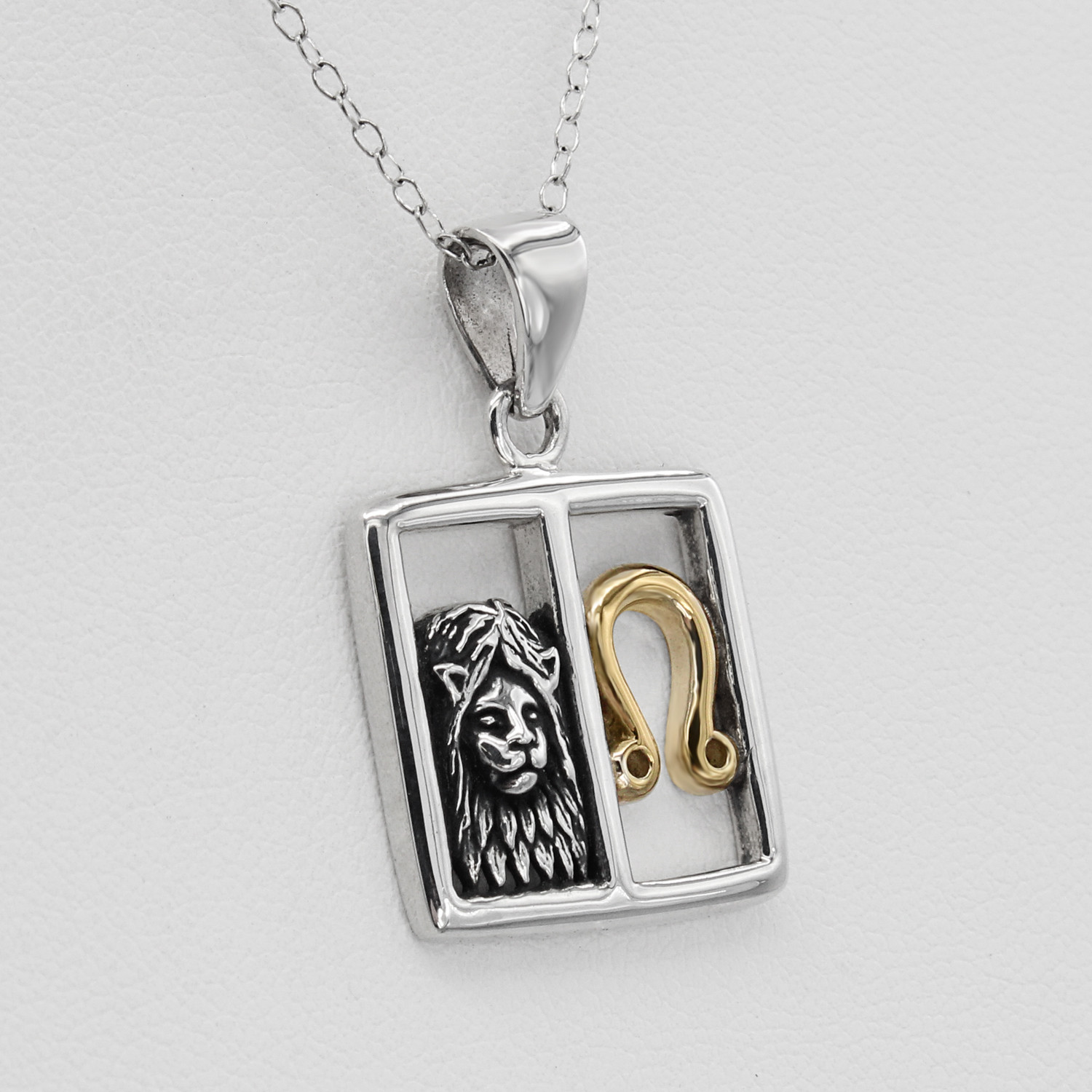Leo necklace in fine .925 sterling silver and gold, featuring a detailed lion head and astrological symbol inside a polished, minimalist square frame