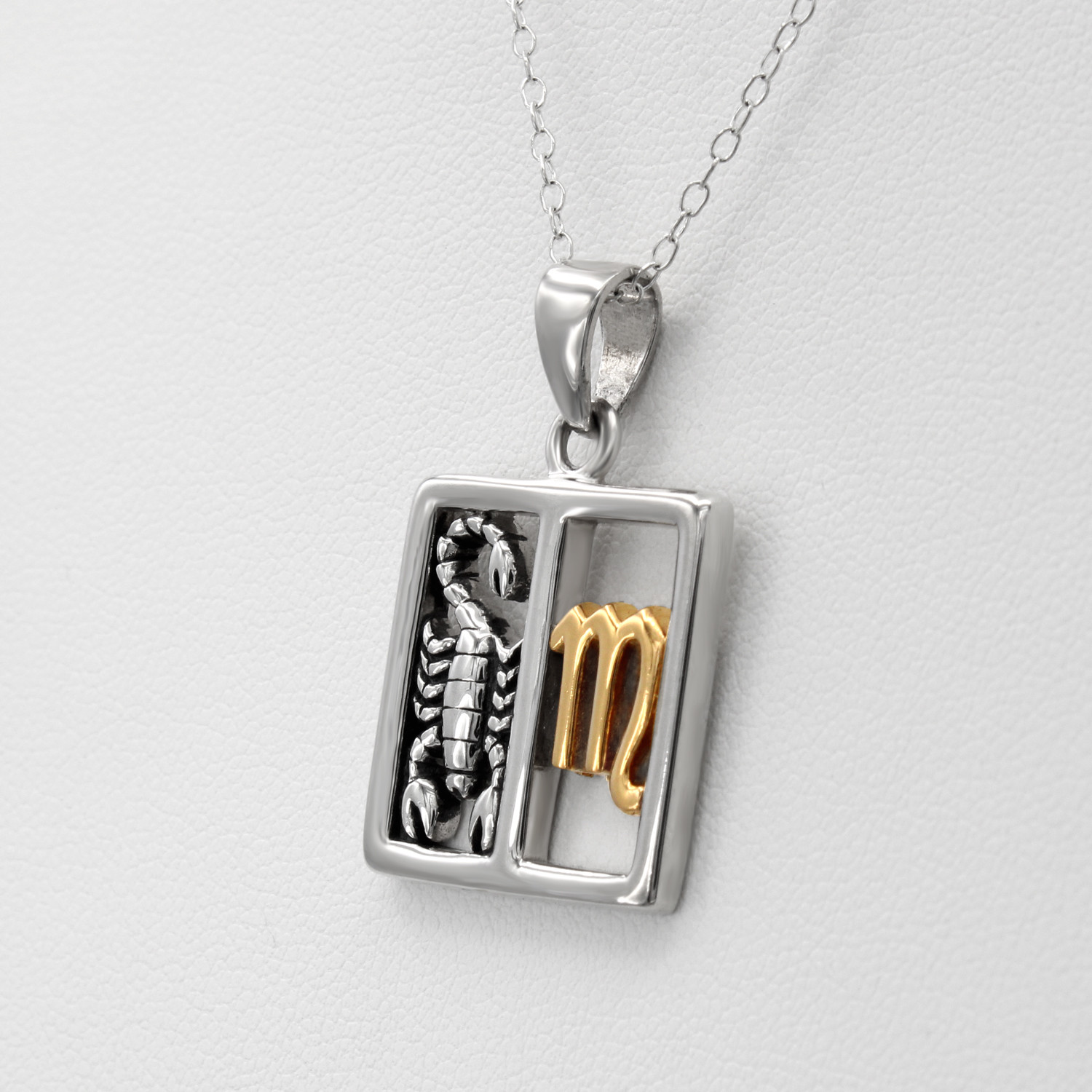 Scorpio necklace horoscope jewelry featuring a balanced split-window design with a three-dimensional silver scorpion and a polished gold Scorpio symbol