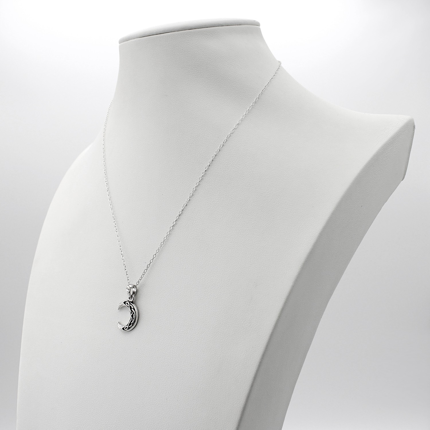 Sterling silver Celtic moon necklace with intricate woven knotwork
