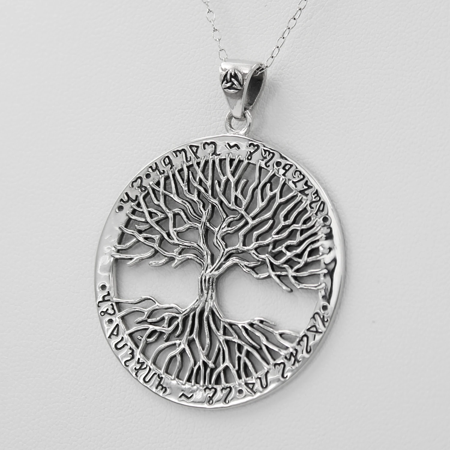Witch necklace made from .925 sterling silver with the saying "as above, so below" written in Theban script around the tree of life