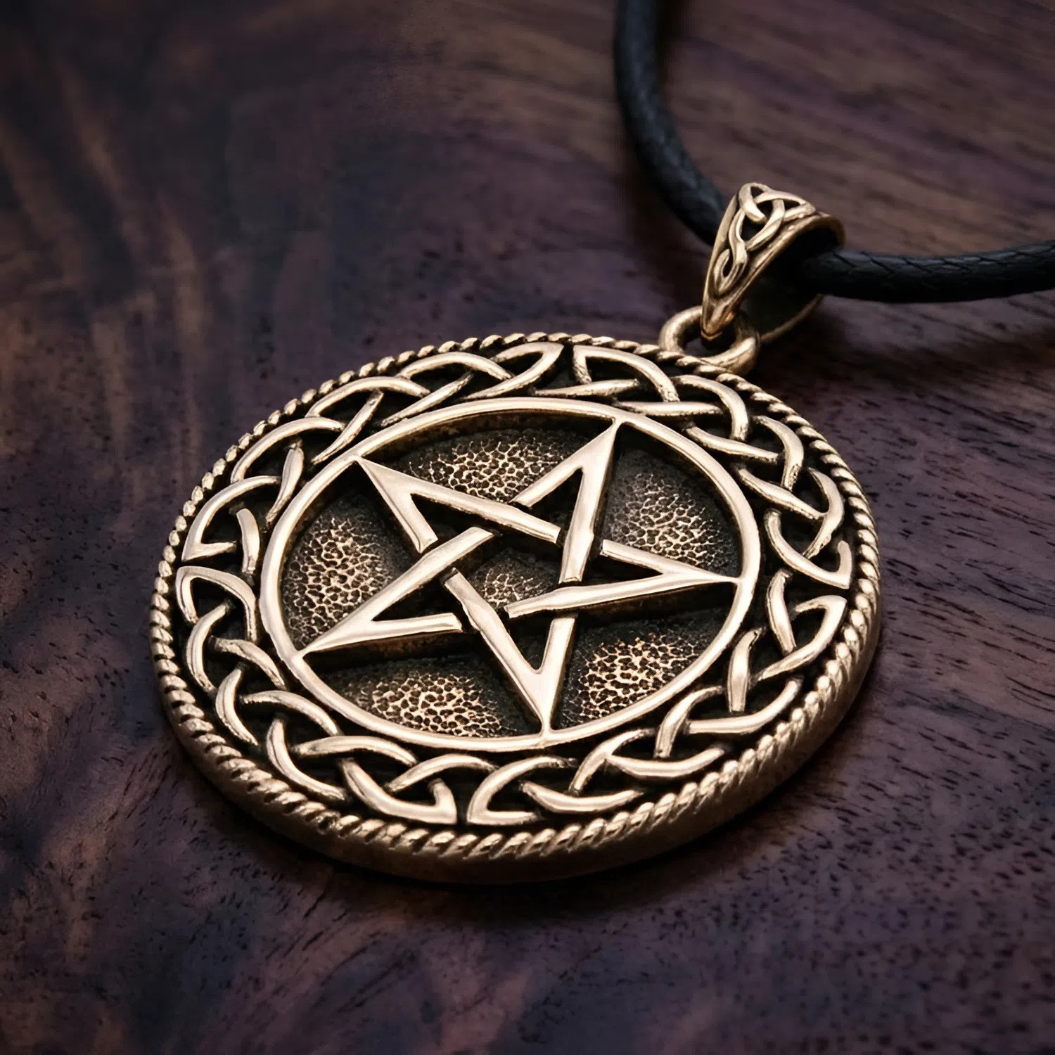 Celtic Pentacle necklace resting flat on a rich dark wood grain surface at our pagan jewelry store