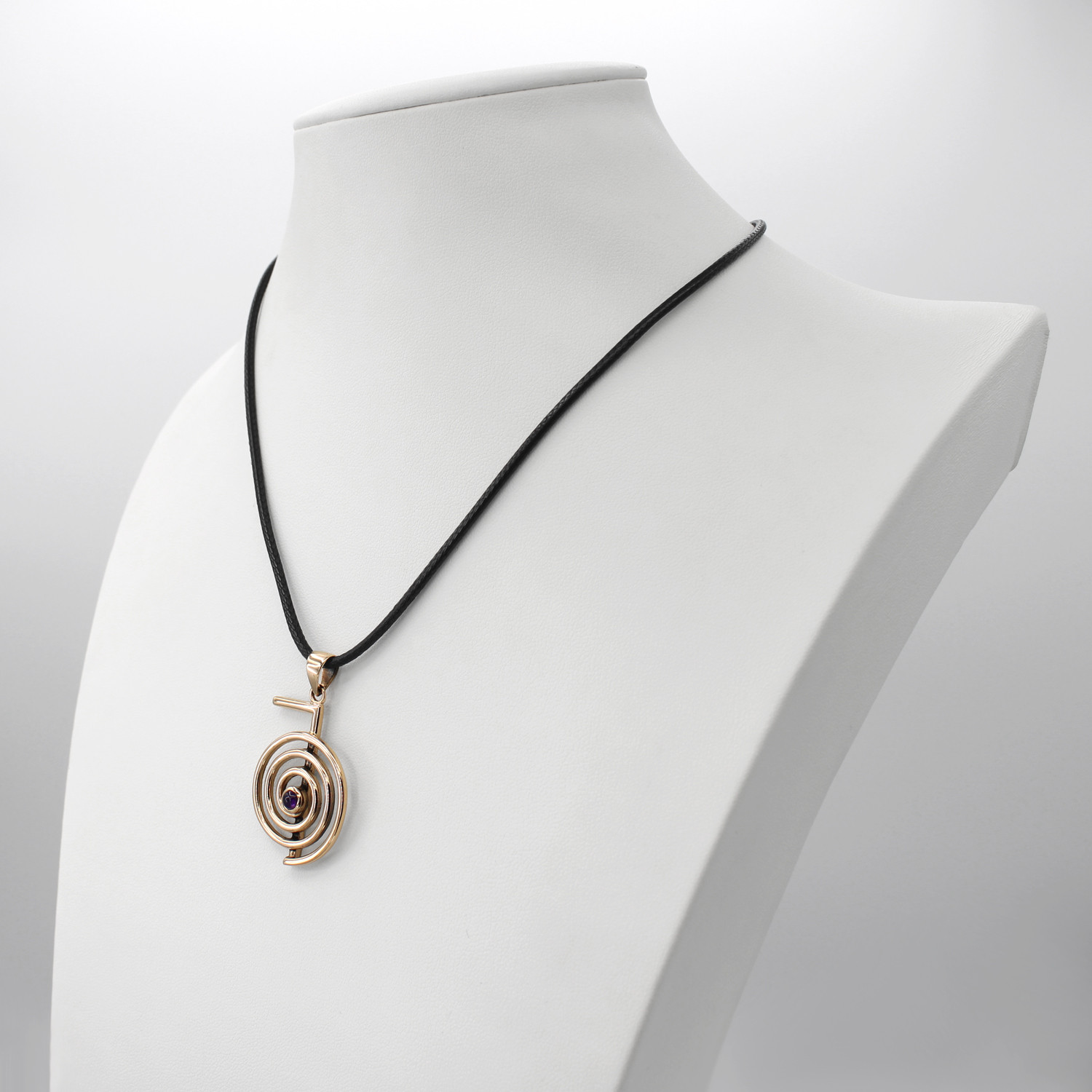 Bronze Cho Ku Rei pendant displayed elegantly on a white jewelry bust, showcasing the black cord and hanging scale of this wellness amulet