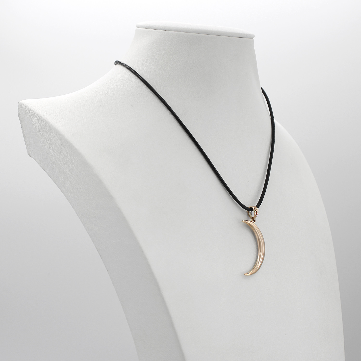 Bronze moon necklace displayed gracefully on a white jewelry bust, showcasing the black cord and the hanging scale of the gold moon pendant