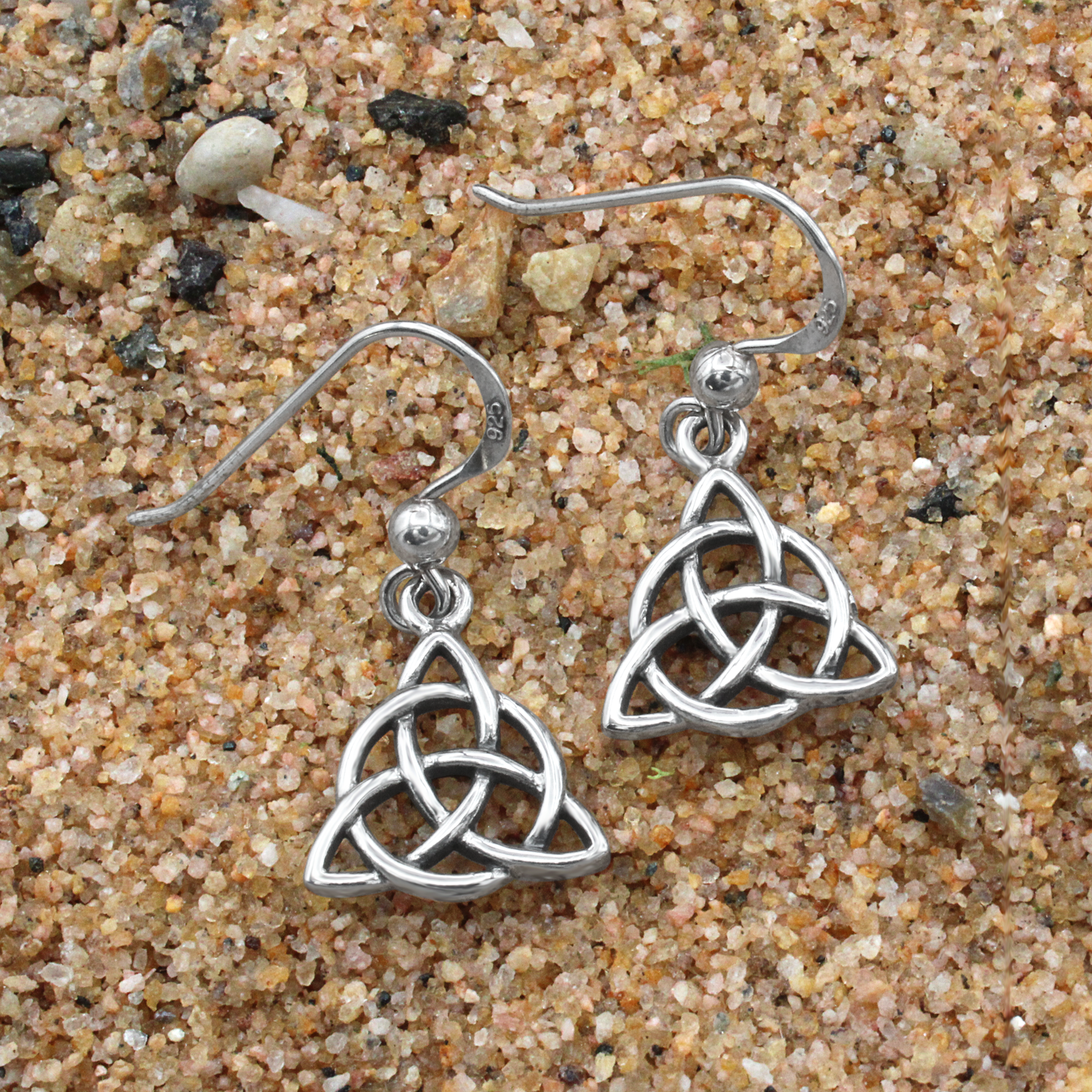 Silver hook earrings featuring an openwork three-pointed Celtic trinity knot design