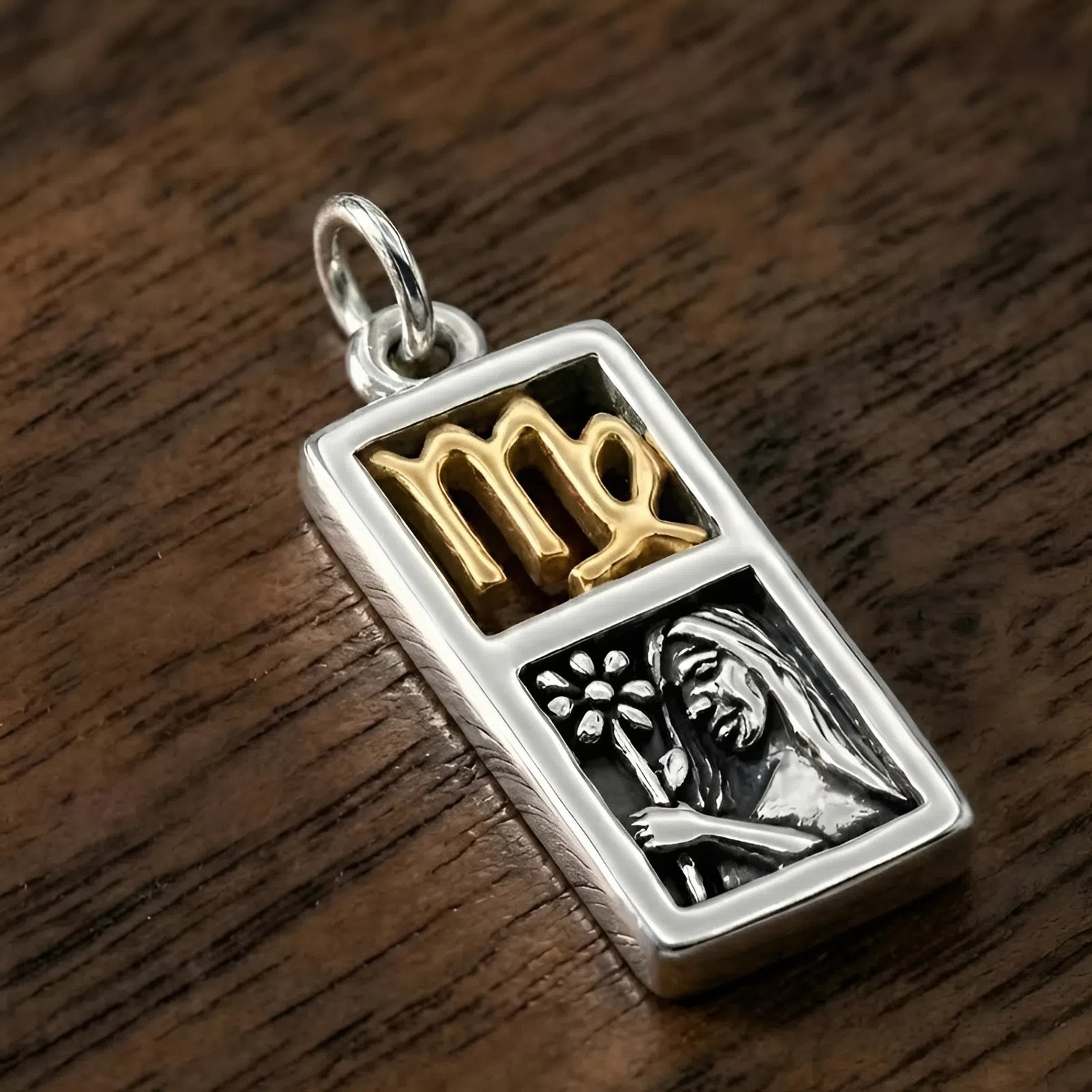 Virgo pendant at our pagan jewelry store in .925 sterling silver and 14k gold vermeil featuring a maiden relief and zodiac symbol, shown on a dark wood background