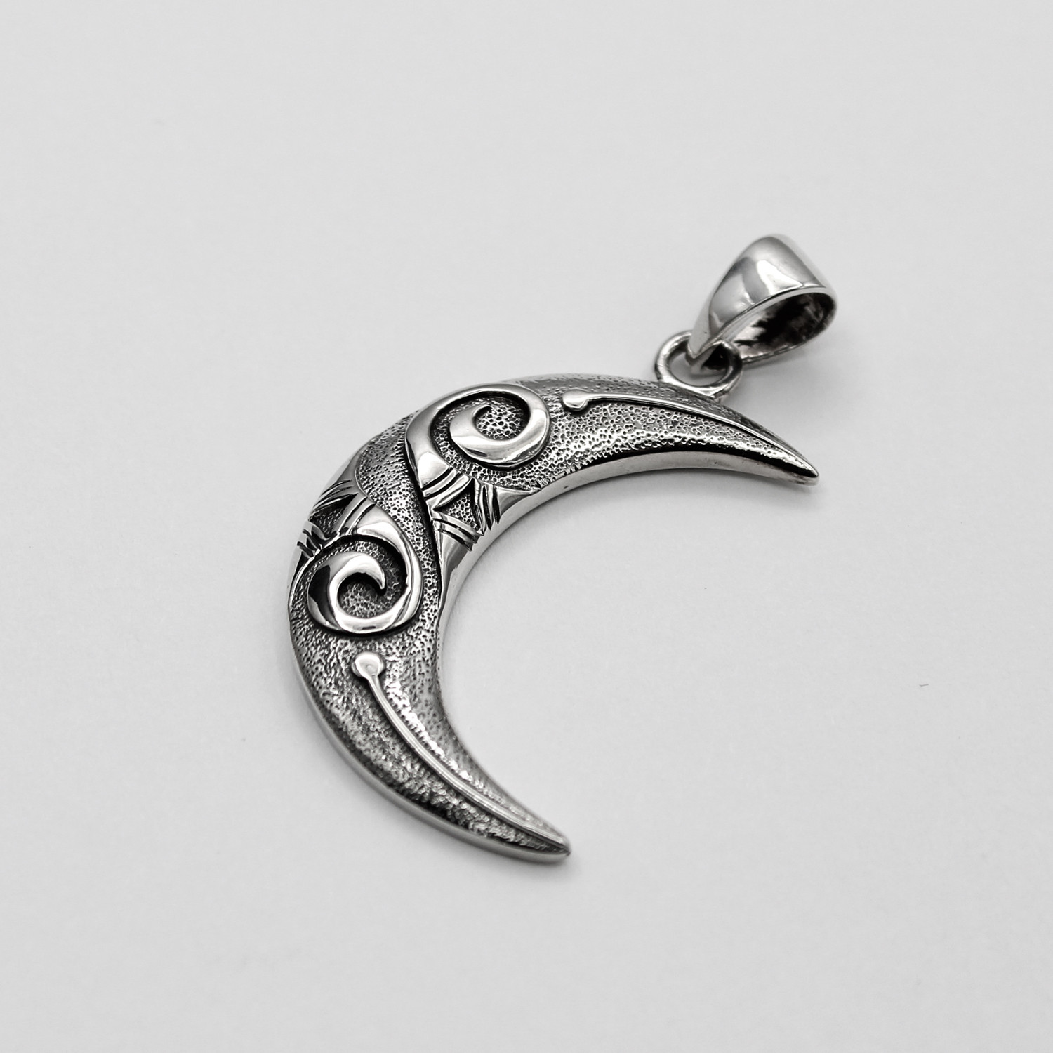 Modern moon pendant with stylized raised spirals, a beautiful large unique crescent moon necklace