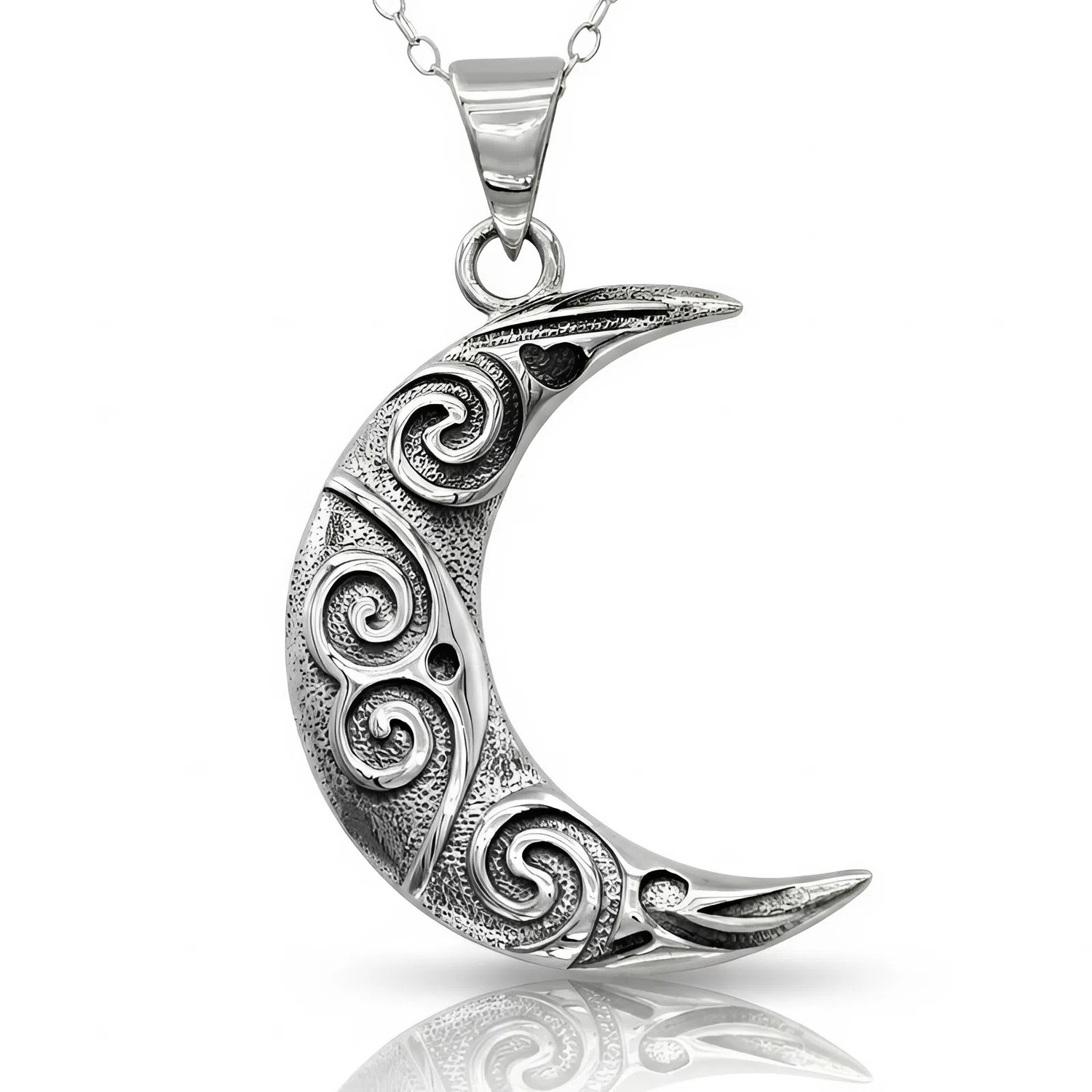Oxidized moon pendant and stylized moon necklace crafted in solid silver, showing a beautiful crescent moon with swirl designs reflecting on a crisp white surface