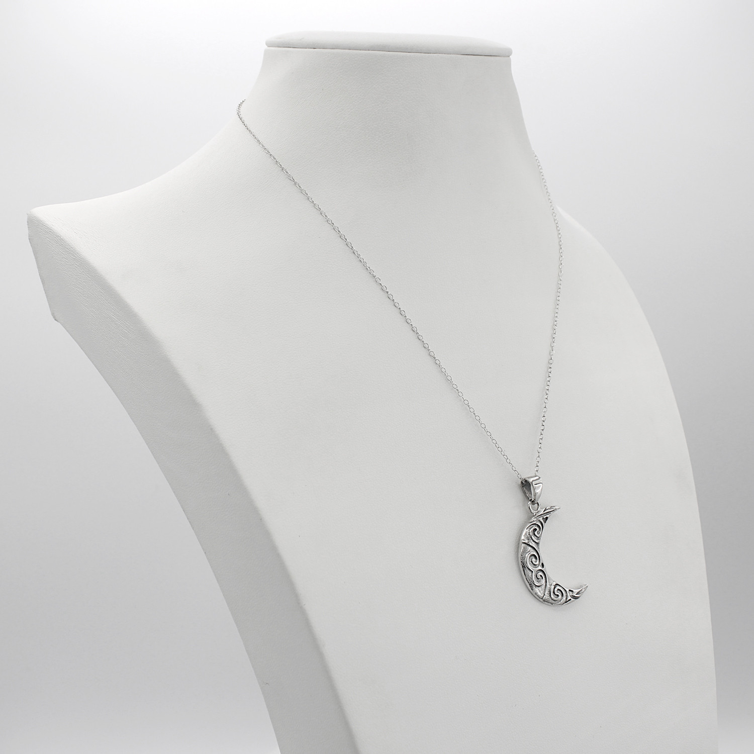 Stylized moon necklace displayed on a white jewelry bust, a perfect everyday crescent moon cast as an oxidized sterling silver moon pendant