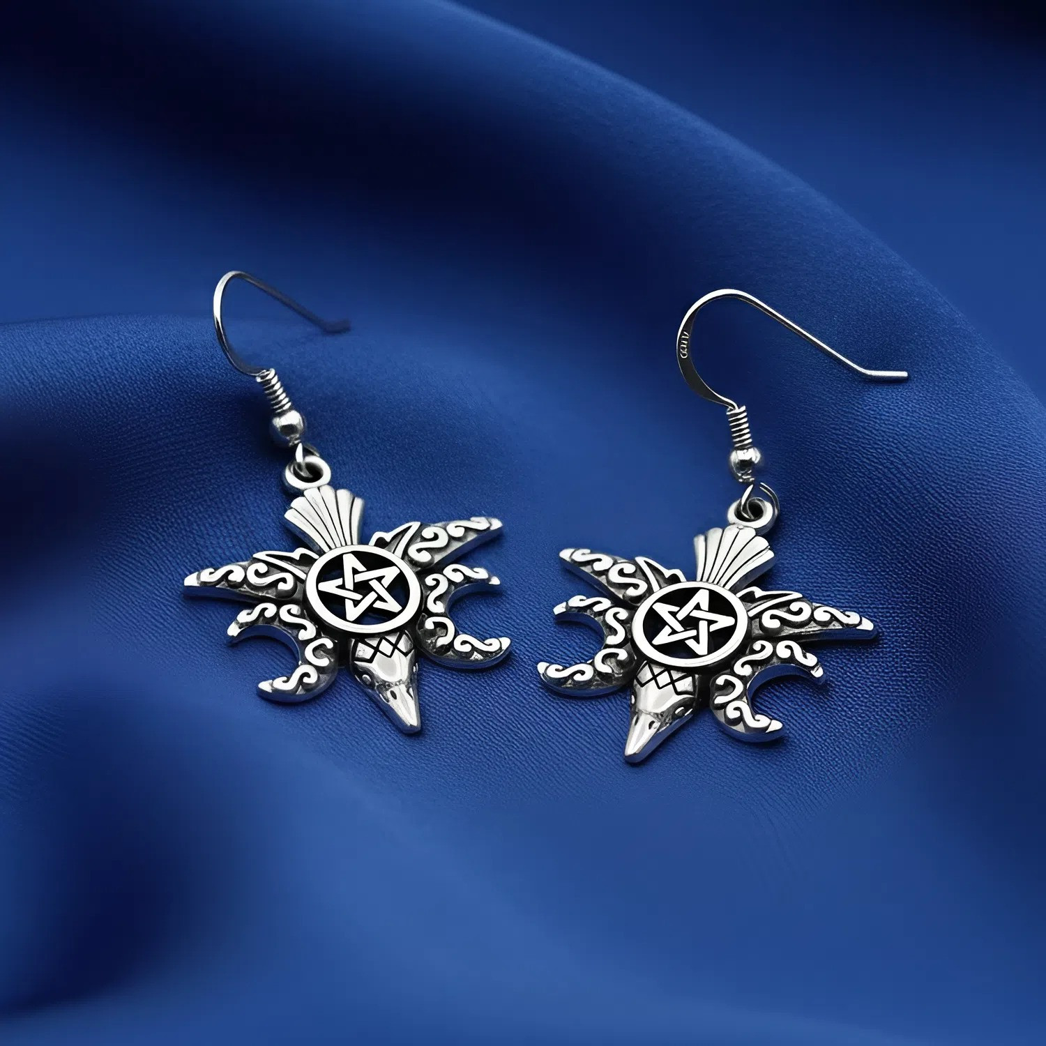 Silver raven hook earrings with a central pentacle star and crescent moons