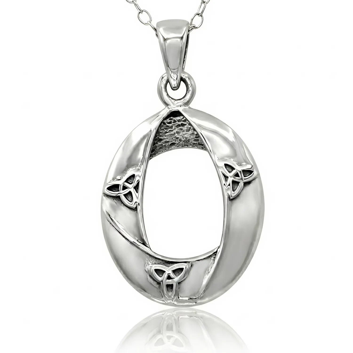Trinity Knot necklace, a beautiful piece of modern Celtic jewelry in sterling silver hanging against a bright white background with a reflection