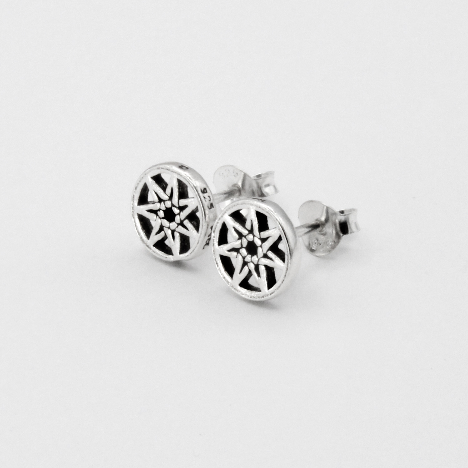 Fairy star jewelry featuring secure post earrings, highlighting the open-cut heptagram design from a clear front angle against a pristine white background