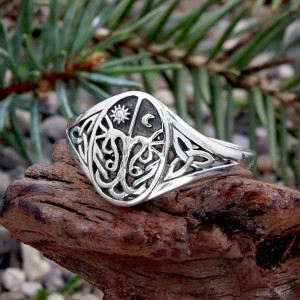 Crafted for the modern witch, this striking ring seamlessly blends the rich heritage of Druid, Celtic, and Pagan traditions. The intricate design features a stylized Tree of Life, a powerful symbol of connection, growth, and the cycle of life. It's an ideal piece for those who honor the old ways, offering both a beautiful aesthetic and a deep, symbolic meaning for your practice. Whether for daily wear or ritual work, this ring is a testament to the enduring magic of nature and the divine feminine.