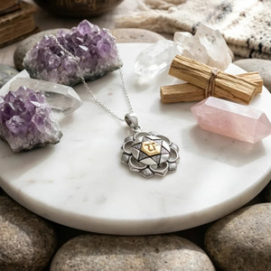 Heart Chakra pendant in sterling silver featuring a polished 14k gold vermeil Anahata symbol