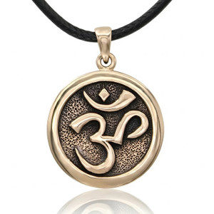 Om Pendant in gold-tone bronze at our pagan jewelry store, featuring a polished raised symbol against a stippled background, hanging straight with a soft reflection on white