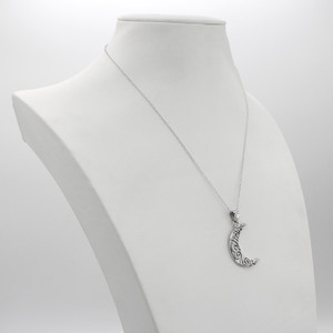 Stylized moon necklace displayed on a white jewelry bust, a perfect everyday crescent moon cast as an oxidized sterling silver moon pendant