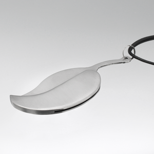 A ritual boline necklace with a polished stainless steel leaf blade on white altar or table, highlighting the purpose of the ceremonial witchcraft knife. A ritual boline necklace with a polished stainless steel leaf blade on white altar or table, highlighting the purpose of the ceremonial witchcraft knife.