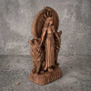 Statue of the dark goddess Hekate wearing a crescent moon crown, standing alongside two wolves and an intertwined snake. A beautiful altar centerpiece from our pagan and wiccan shop, providing premium witchcraft supplies and witch store supply.
