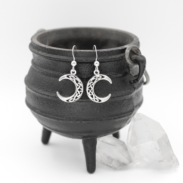 Celtic Witchy Earrings Hanging on Black Cauldron