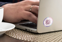 A Lost and Found Label on a silver laptop.