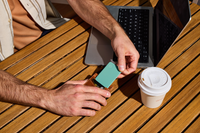 Image of a Tile Slim- Seaglass being put into a wallet